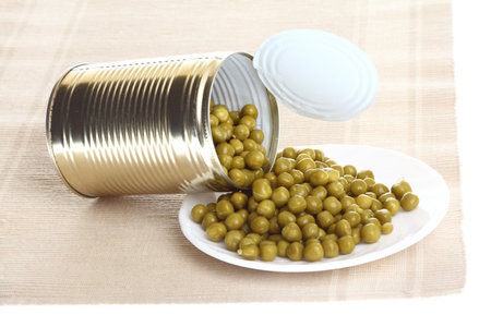 Tin opening a can of food canned, tinned peasの写真素材