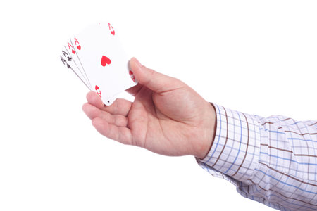man and playing cards in hand isolated