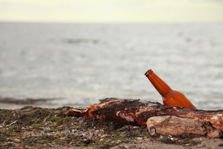 bottle on beach sea and skyの写真素材