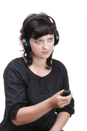 smiling woman with headphones isolated on white backgroundの写真素材