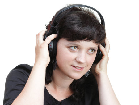 smiling woman with headphones isolated on white backgroundの写真素材