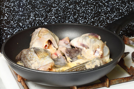 to pan-fry sth Raw cod fish fillets in kitchenの写真素材