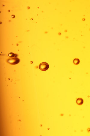 soap bubbles orange liquid backgroundの写真素材