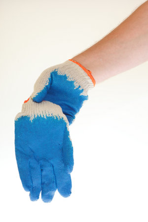 man hand in blue glove  Isolated on white background の写真素材