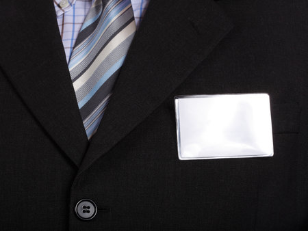 Business man handing a blank card isolated over white backgroundの写真素材