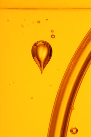 soap bubbles orange liquid backgroundの写真素材