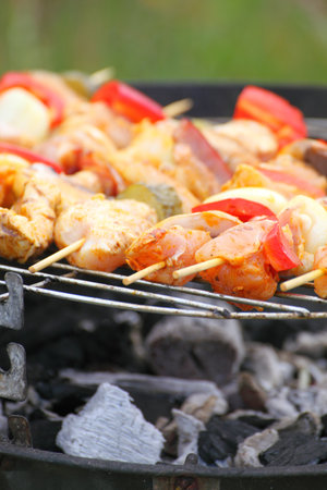 Flames grilling a steak on the BBQ bonfire, campfire summerの写真素材