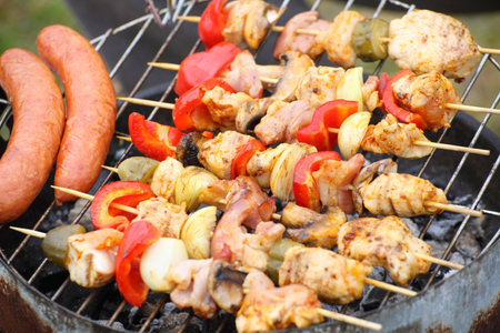 Flames grilling a steak on the BBQ bonfire, campfire summerの写真素材