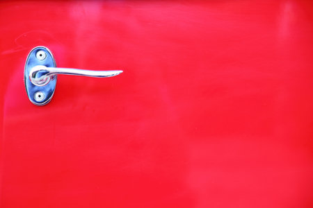 detail of vintage red car doorの写真素材