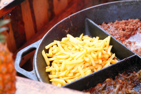 Grilled Fries and meat on the barbecue outdoor restaurantの写真素材