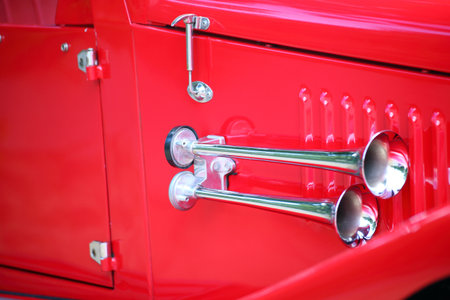 cropped image of a fully restored classic old car with lots of shiny chromeの写真素材