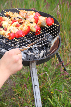 Flames grilling a steak on the BBQ bonfire, campfire summerの写真素材