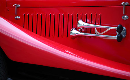 cropped image of a fully restored classic old car with lots of shiny chromeの写真素材