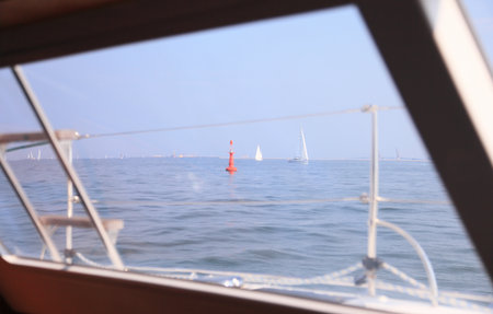 Boat porthole sailboat view blue ocean sea sky horizon outdoor sportの写真素材