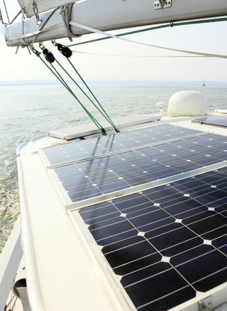 Solar charging batteries aboard a sail boat Photovoltaic panels energy conceptの写真素材