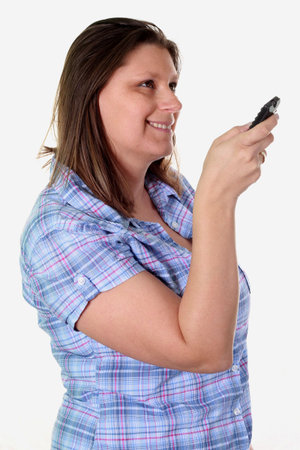 beautiful girl with remote control の写真素材