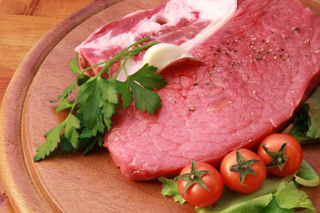 Raw meat  on a cutting boardの写真素材
