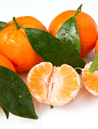 Mandarin with leaves, isolated on whiteの写真素材