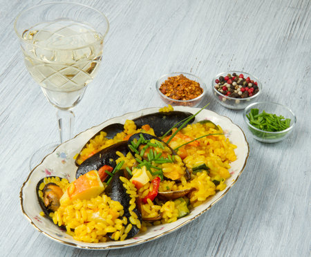 Close-up of Spanish paella on white plateの写真素材