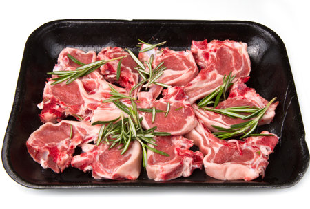 Racks of lamb, ready for cooking, with fresh rosemaryの写真素材