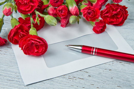 Spring letter and red carnationの写真素材