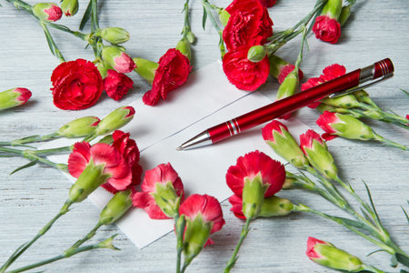 Spring letter and red carnationの写真素材