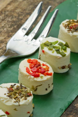 cheese with spices  on wooden backgroundの写真素材