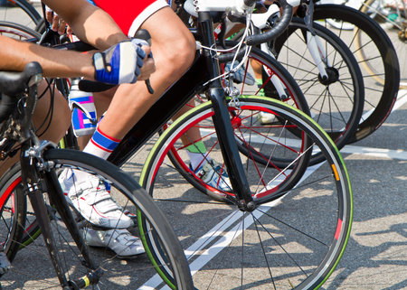 The cyclists riding by at the bicycle raceのeditorial素材