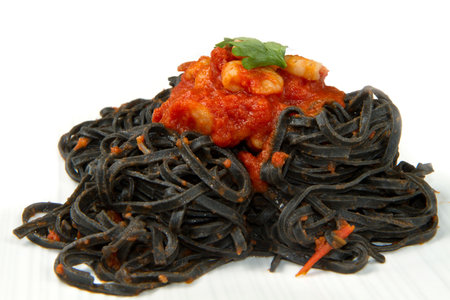 black pasta  with tomatoes sauce and shrimpの写真素材