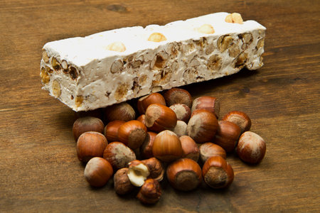nougat with hazelnut on wooden tableの写真素材