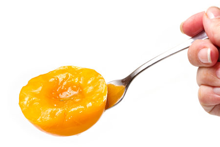 Peach halves in light syrupの写真素材
