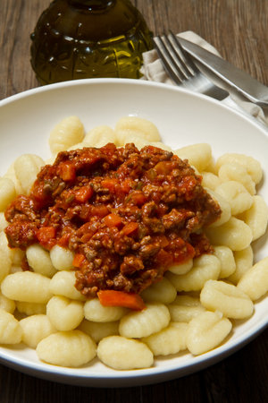 gnocchi with bolognese sauce plate の写真素材