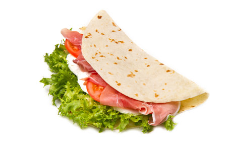 italian piadina with ham, fresh salad and mozzarella cheeseの写真素材