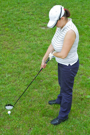 An image of a young female golf player の写真素材