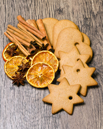 biscuits with  cinnamon and  orange dried on wooden tableの写真素材