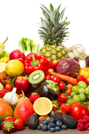Fruits and vegetables like tomatoes, zucchini, melons, bananas and grapes arranged in a group, natural still life for healthy food の写真素材