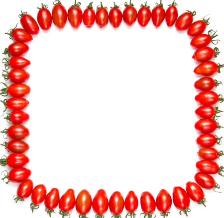 frame of red tomatoes isolated on a white background の写真素材