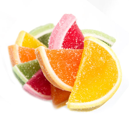 Color fruit jelly candies isolated on white background の写真素材