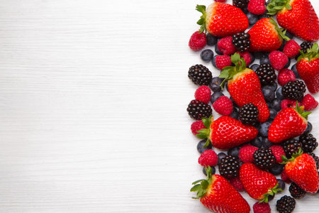 Berry over white  Wood  Strawberries, Raspberries, Blueberryの写真素材
