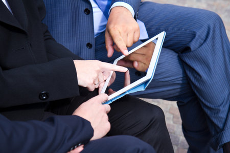 teamwork analyzing digital document の写真素材