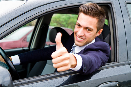 Happy man in his new car 