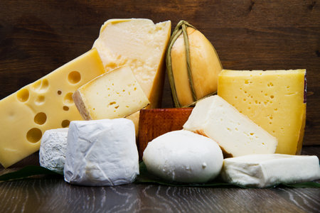 Various types of cheese on woodの写真素材