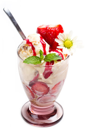 Vanilla ice cream with fresh strawberry in cup on white background の写真素材