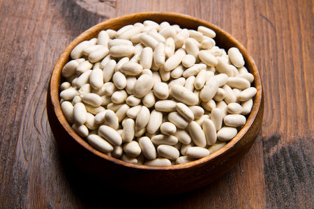 cannellini beans on wood bowl