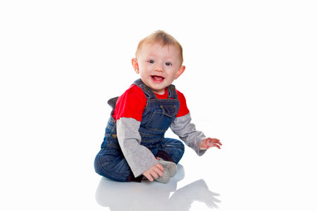 portrait of smiling baby boy isolated on white background