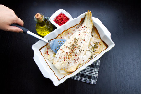 white baked cod with pepperの写真素材