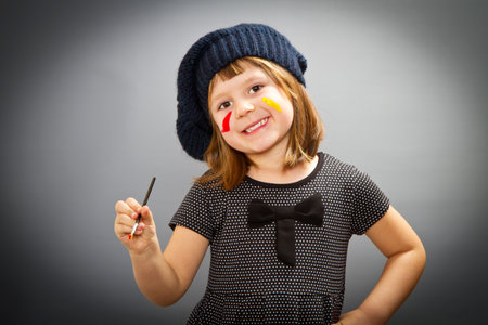 little painter girl  looking isolated on grey