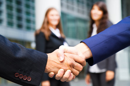 Business handshake and business peopleの写真素材