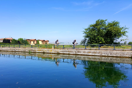 cyclists on the Naviglioの写真素材