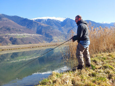 Fisherman on the river bankの写真素材